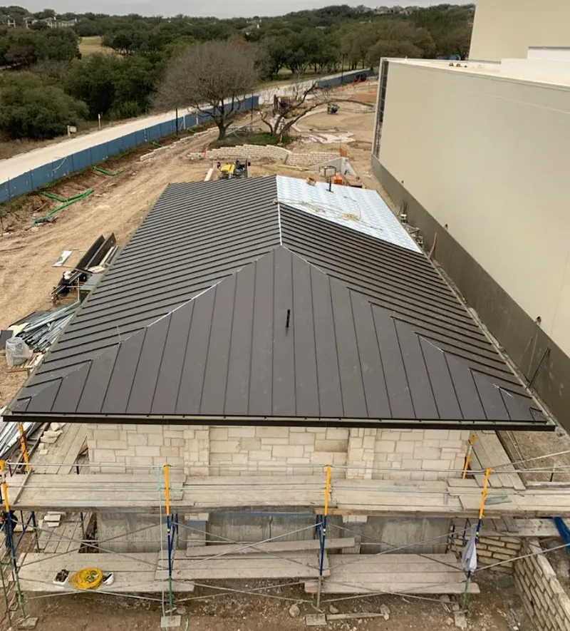 Metal roof new construction with scaffolding in Northampton